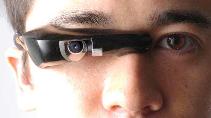 Mann's 'GlassEye™' invention, also known as an EyeTap device, is an input+output device that can connect to a smart phone or other body-borne computer, wirelessly, or by a con